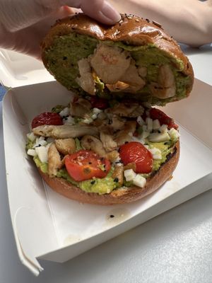 Vegan chicken, avocado, tomato and vegan cheese in a huge seeded bagel   at California Bakery - Corso Garibaldi in Milan