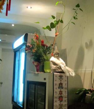 Decoration and fridge with take-out dishes at Quan Bo De Cuisine Vegetarienne in Montreal