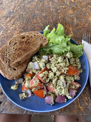 Tofu scramble (tofu with basil, tomatoes, and red onions) and two slices of toast (no butter)  at Hidden Tree Cafe & Restaurant in Koh Lanta