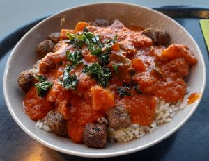 Falafels, tomato sauce, curry vegetables, kale and rice. at Ravintola Arvo in Espoo