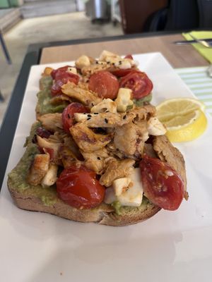 Plant based chicken and avocado sandwich with vegan cheese and tomatoes   at California Bakery - Via Larga in Milan