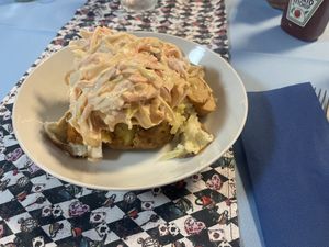Jacket potato loaded with coleslaw and vegan meat  at Mac's Tearoom in Gran Canaria