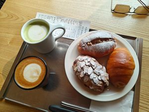cappuccino, oatmilk matcha latte, and various salt bread. at Leedorim in Seoul