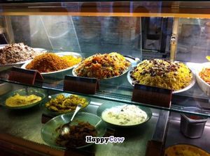 Food displayed behind the case at Orient Experience in Venice