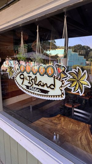 Logo and window facing the entry  at 9th Island in Haleiwa