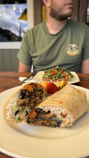 Sweetpotatoe burrito and avo toast in the background  at 9th Island in Haleiwa