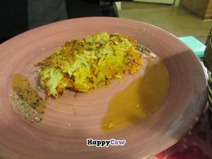 Grated vegetables and potatoes over a chickpea base - main course of set lunch menu. at Rayen Vegano in Madrid