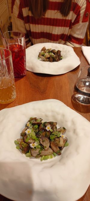 Porcini mushrooms with green onions & edible flowers at Auberge Des Aryelets in Aulon