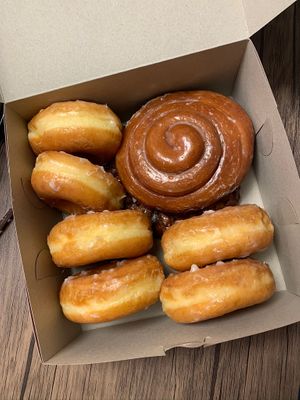 Glazed donuts, cinnamon roll on top of an apple fritter at Ronald's Donuts in Las Vegas