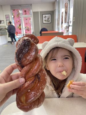 Size of cinnamon twist compared to small vegan child’s head lol  at Ronald's Donuts in Las Vegas