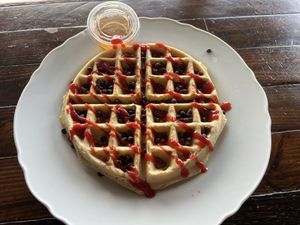 Full waffle with chocolate chips and strawberry pureé  at A Lo Vegano Orlando in Orlando