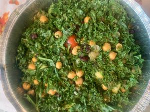 Kale & Cucumber Salad - Kale, fresh cucumbers, chickpeas, chopped red onions, grape tomatoes and dried cranberries with vegan mint & cilantro dressing at India Restaurant in Providence