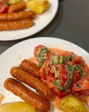 Chorizo "sausages" by Heura. I fried them and served with simple tomato salad and boiled potatoes. Simple vegan food always has rich taste 🤤 at La Sirena in Premia De Mar