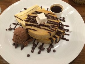 Pancakes with 'butter', maple syrup, bananas, brown rice ice cream and chocolate sauce.  at CHOICE in Kyoto