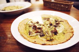 Pesto pizza with vegan cheese at CHOICE in Kyoto