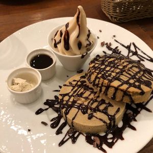 Chocolate pancake with vegan butter, syrup, and ice cream. at CHOICE in Kyoto