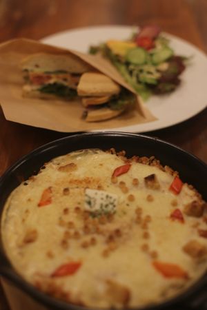 cheese sandwich and seasonal special in front
 at CHOICE in Kyoto