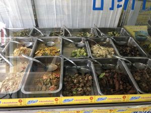 Food behind the glass case  at Nam Heng Vegetarian in Phuket