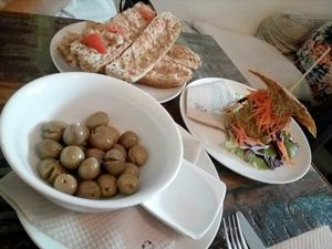 Bread with tomatoes, olives, and Love sandwich at El Cafe Blueproject in Barcelona