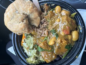 Sweet potato and chickpea curry with rice and pea and a dumpli  at Radcliffe Market in Radcliffe