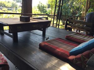 Hang out and read a book by the river at Happy Green in Chiang Mai