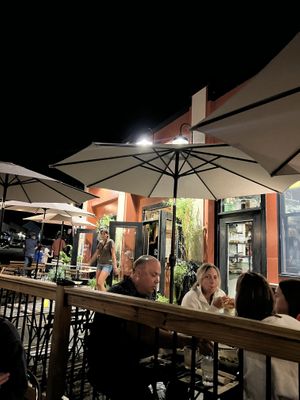 Cute outdoor patio. Inside is filled with greenery and vintage windows  at Purslane Eatery in Wakefield