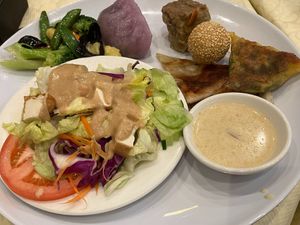 My plate from the buffet at SFVS happy vegan holidays 2024 at Sassy Foods in San Francisco