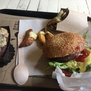 Burger, chips, & carrot cake. Very filling amongst the 3! at Hank Cuisine Végétale - Archives in Paris