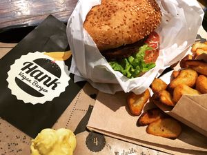The La Catcheuse burger: creamy mustard sauce and alfalfa. With a side of potatoes. at Hank Cuisine Végétale - Archives in Paris