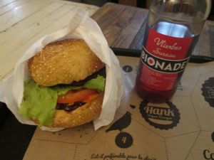 A burger with american dressing and an organic soft drink at Hank Cuisine Végétale - Archives in Paris