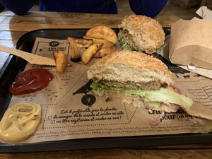 Half eaten burgers - couldn’t wait to dig in! at Hank Cuisine Végétale - Archives in Paris