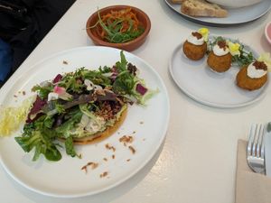 Arepa, kimchi and croquettes at Let It Bloom in Valencia