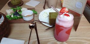 Vegan cheese plate, cake and a strawberry milkshake. at Wassaï in Lyon