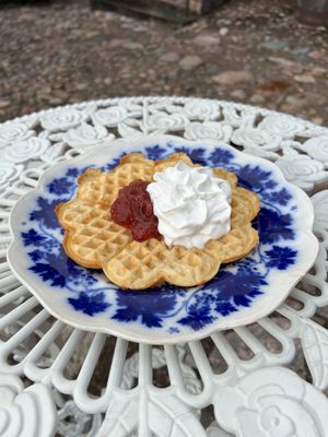 Waffle with vegan cream and jam  at Hallska Gårdens Café in Graenna