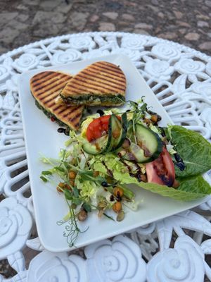 Panini with pesto, vegan mozzarella and sun-dried tomatoes  at Hallska Gårdens Café in Graenna