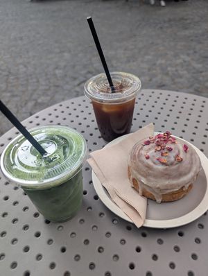 Iced matcha oat latte, iced Americano, glazed cinnamon roll at High Grade Coffee in East London
