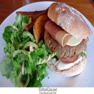pogo cafe vegan punk burger with side salad and potatoes at POGO Cafe in East London