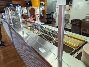 Updated serving area with glass shields in place at Silantra Asian Street Kitchen in Camp Hill