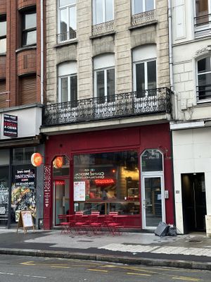 Storefront from across the street   at Nomás Tacos in Lille