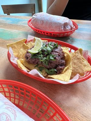 Vegan, wrapped Burrito and Nachos with bean dip   at Nomás Tacos in Lille