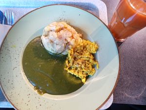 Creamy spinach with roasted potatoes and vegan scrambled egg at Vegetaria in Vienna
