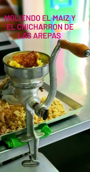 making our corn arepas with vegan chicharron at Naturalmente in Bogota