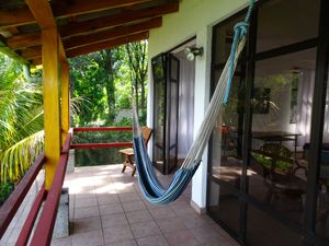 Balcony with hammock at The Glowing Gourmet in San Pablo La Laguna