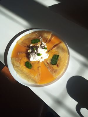 Pancakes with awesome creme and orange something and mint. Delicious at Kruzhok in Yerevan