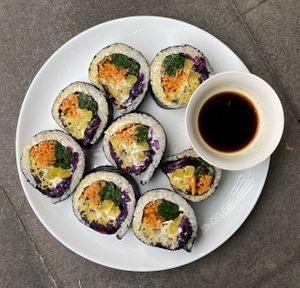 Kimbap: nori sheets, rice, cashew aioli, soy mayonnaise, red cabbage, carrotcha, chickpea "tuna", pickled daikon, spinach, green onion, sesame oil at Kruzhok in Yerevan