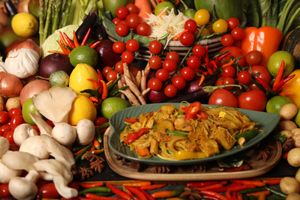Plant-Based Chicken Singapore featuring tender plant-based chicken chunks stir-fried with thin rice vermicelli noodles. This dish includes a colourful array of vegetables. at Kats Oriental Cuisine in St Albans