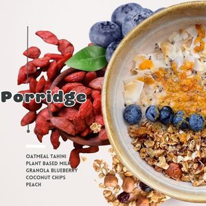 Oats, tahini, plant-based milk, granola, blueberries, coconut chips, peach. at Sisu Kitchen %100 Vegan in Antalya