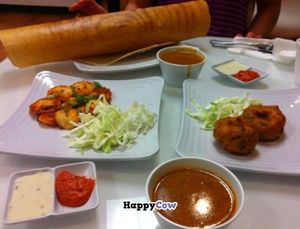 Clockwise from top: Masala Dosa (vegan), Lentil Soup (vegan), Medu Vada (the circely things, vegan), more Lentil Soup, various vegan chutney, Butter idli (not vegan, eaten by vegetarian pal). 

Super fun. at dgn Factory - Richmond Ave in Houston