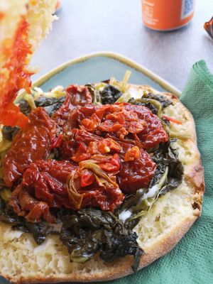 Puccia "Vega" with dried tomatoes, crema di peperoni, and spinach at L'isule Cafè in Cannobio