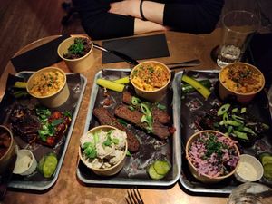 Bar a couple of sides this is "one of everything". Smoked Tofu, Brisket, Ribs, mini mac, coleslaw, potato salad, and burnt ends in the top left. at Saint Monday in East London